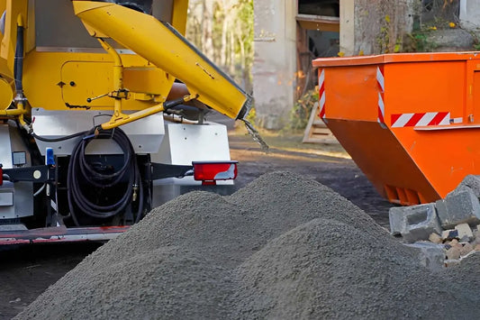 Concrete sand pile being loaded for a construction project and material delivery.