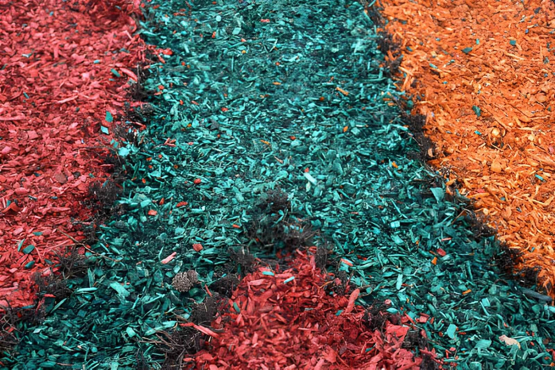 Red, green, and orange dyed mulch rows