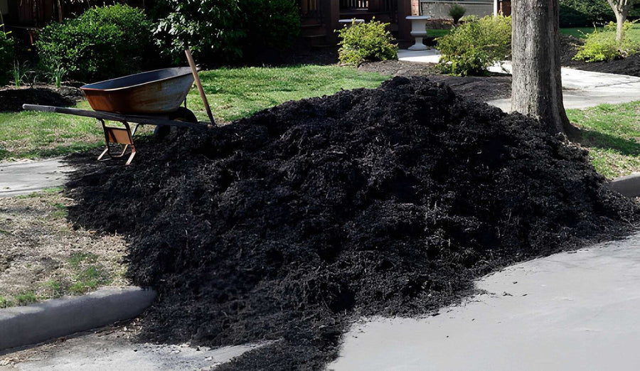 Pile of black mulch ready for landscape installation
